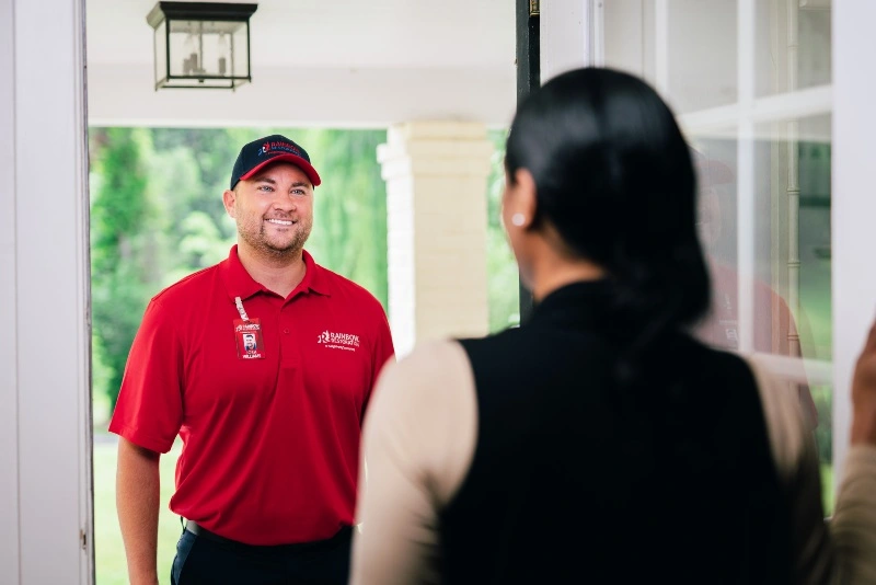 Rainbow Restoration specialist greeting a customer