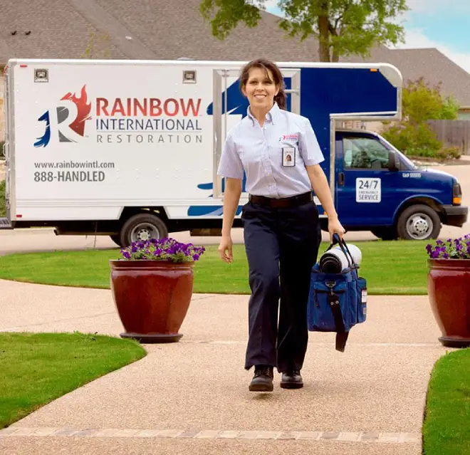 Rbw technician carrying a bag.