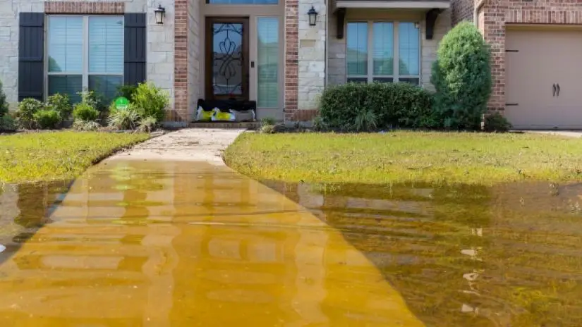 Residential home with flooded front yard