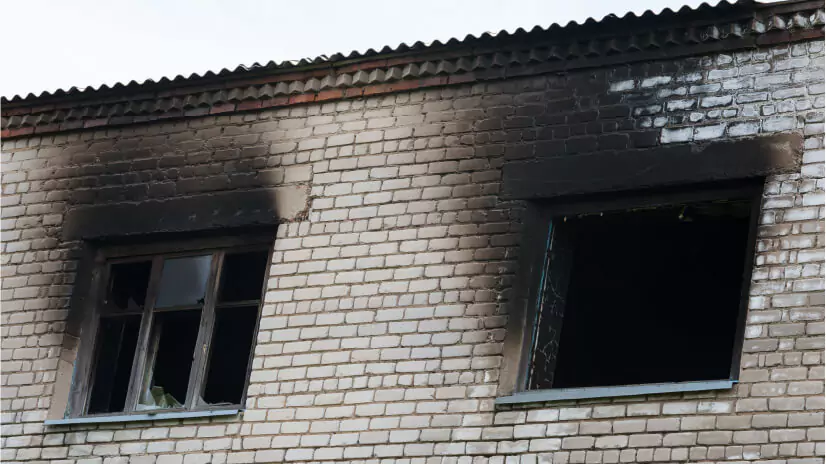 Building with smoke damage from a fire.